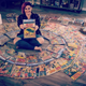 Danielle Smith with her collection of Action Comics, including the first appearance of Superman..